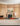 Классика и современный дизайн в эффектном интерьере апартаментов с деревянными панелями на стенах